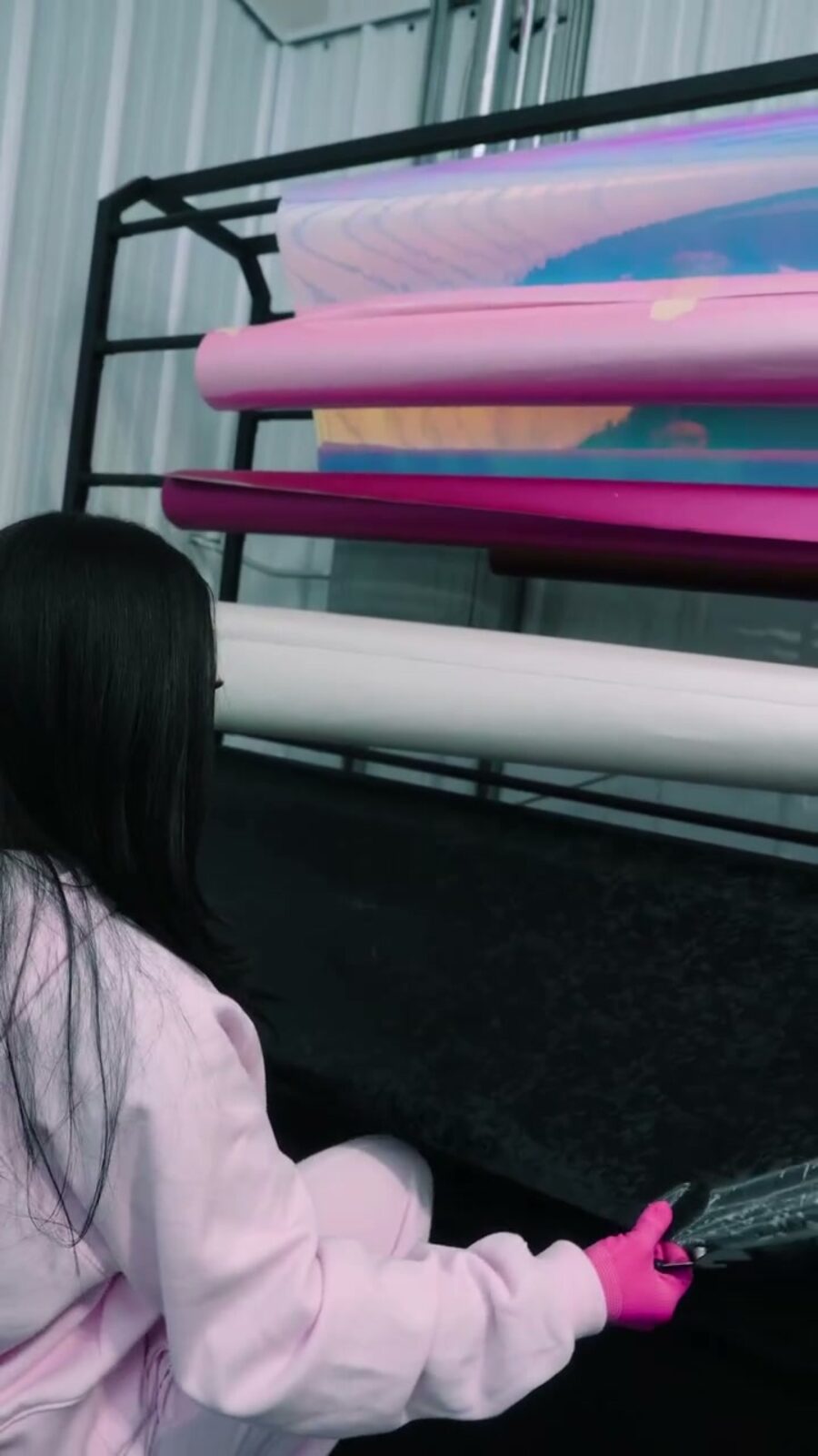 Pink and chrome film rolls in the rack